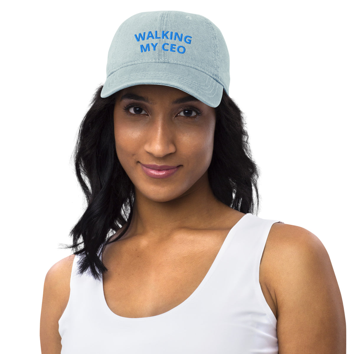 Woman wearing a light blue cap with 'MONK & NUN' logo on a white background
